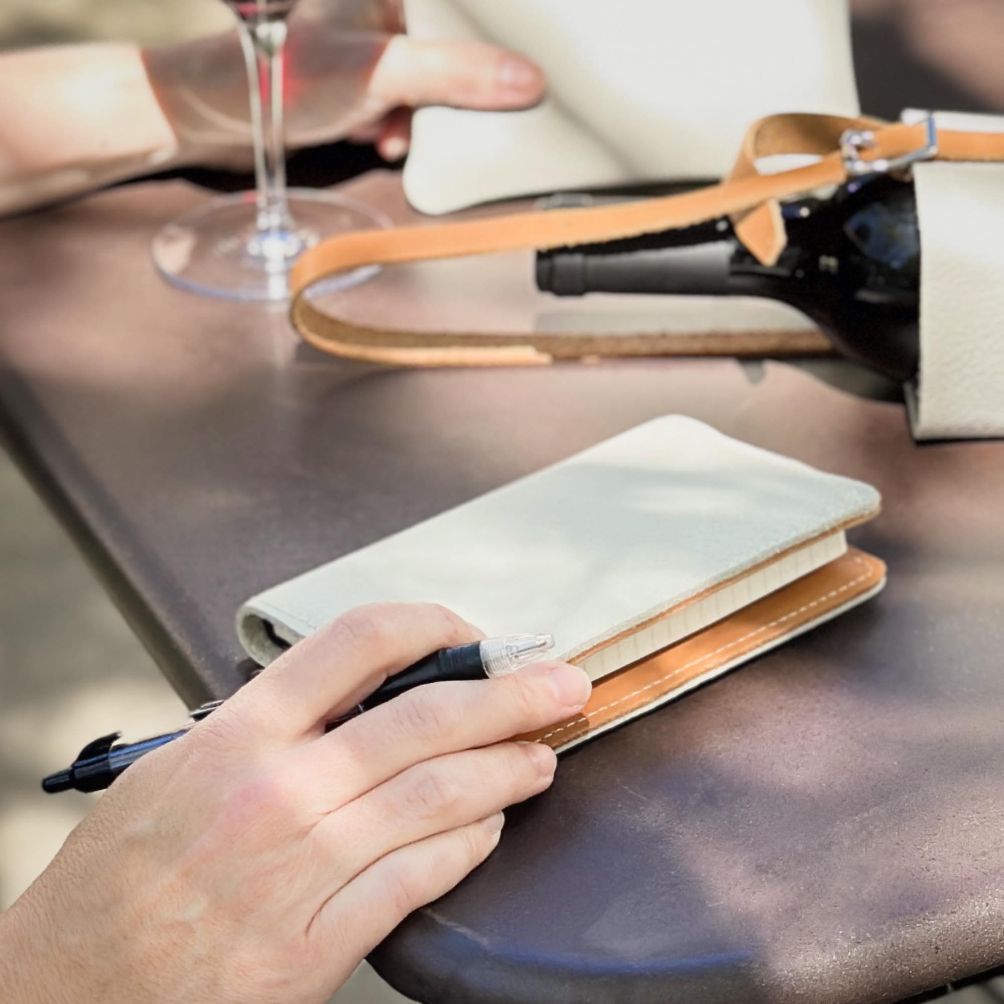 Pacific fog pocket notebook cover on table with wine bottle