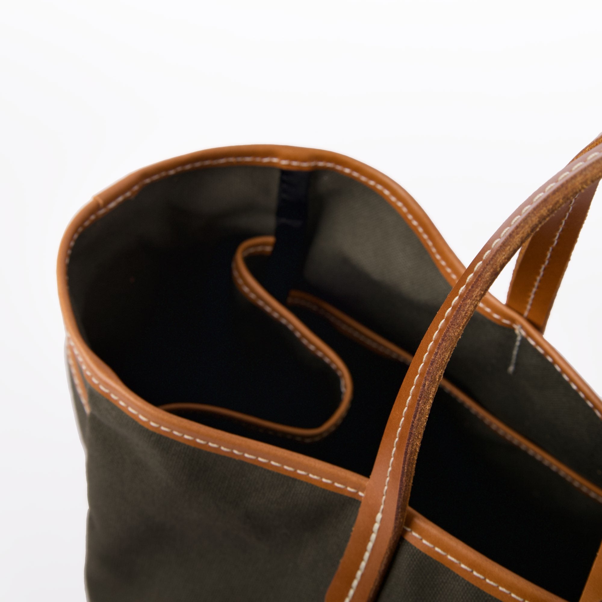 Day and night tote in dark olive canyon by sonoma county leather piping and stitching detail