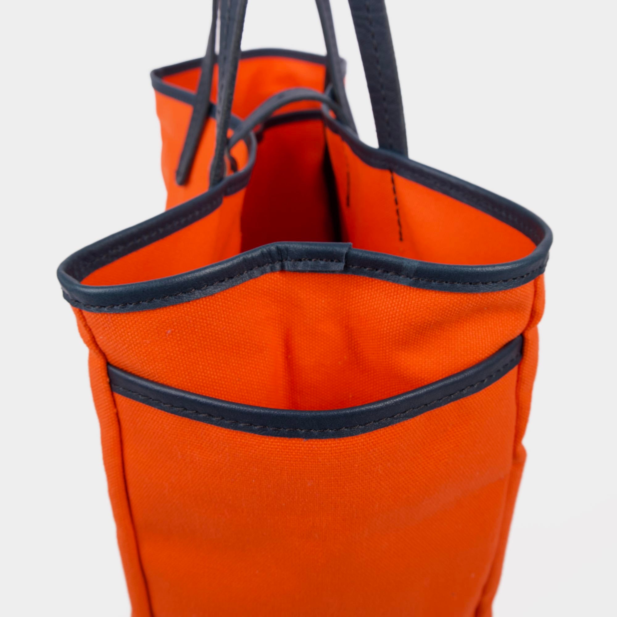 Day and night tote in orange navy by sonoma county leather pocket detail