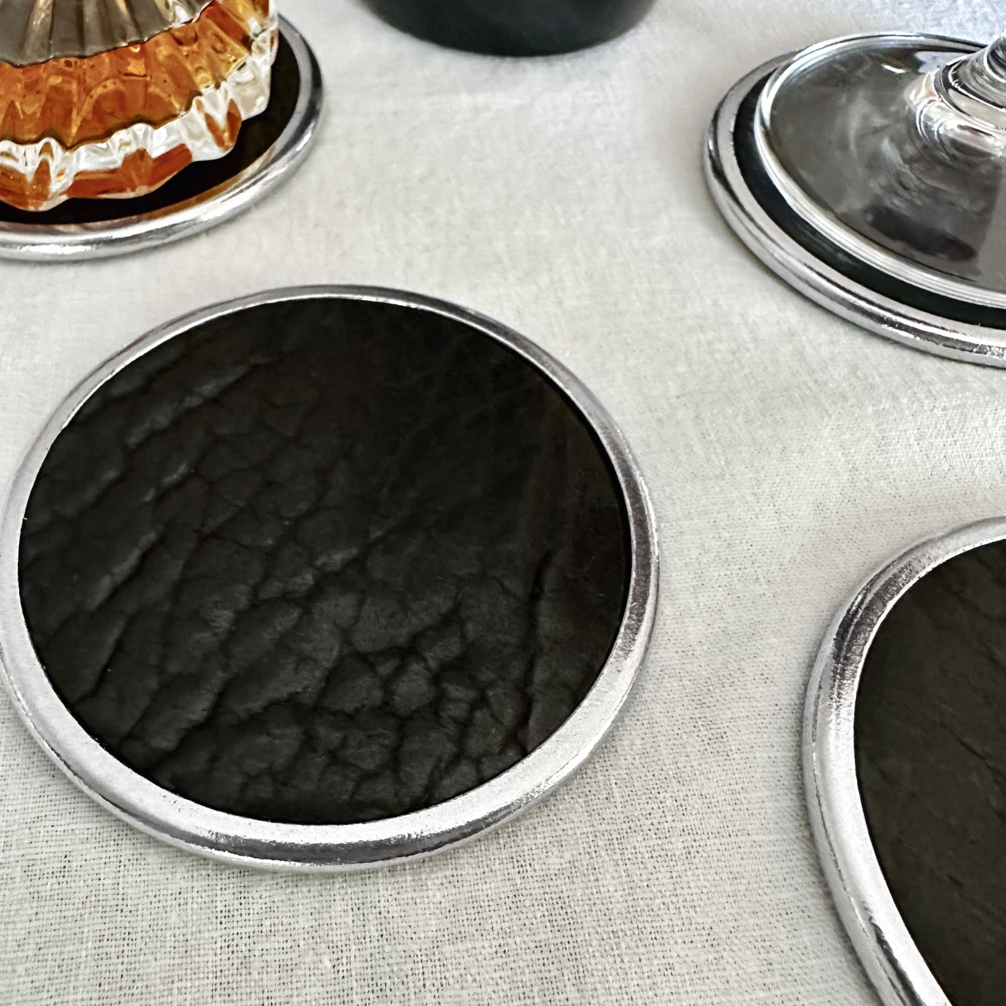 Premium Leather & Metal Coasters, Bison black by sonoma county leather table setting lifestyle