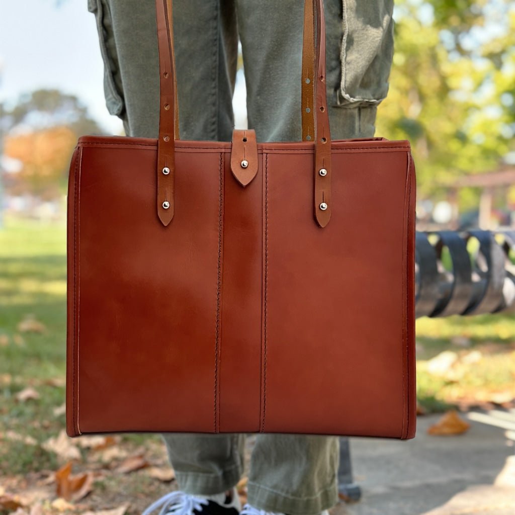 Sonoma tote in tahoe whiskey by sonoma county leather hand holding lifestyle