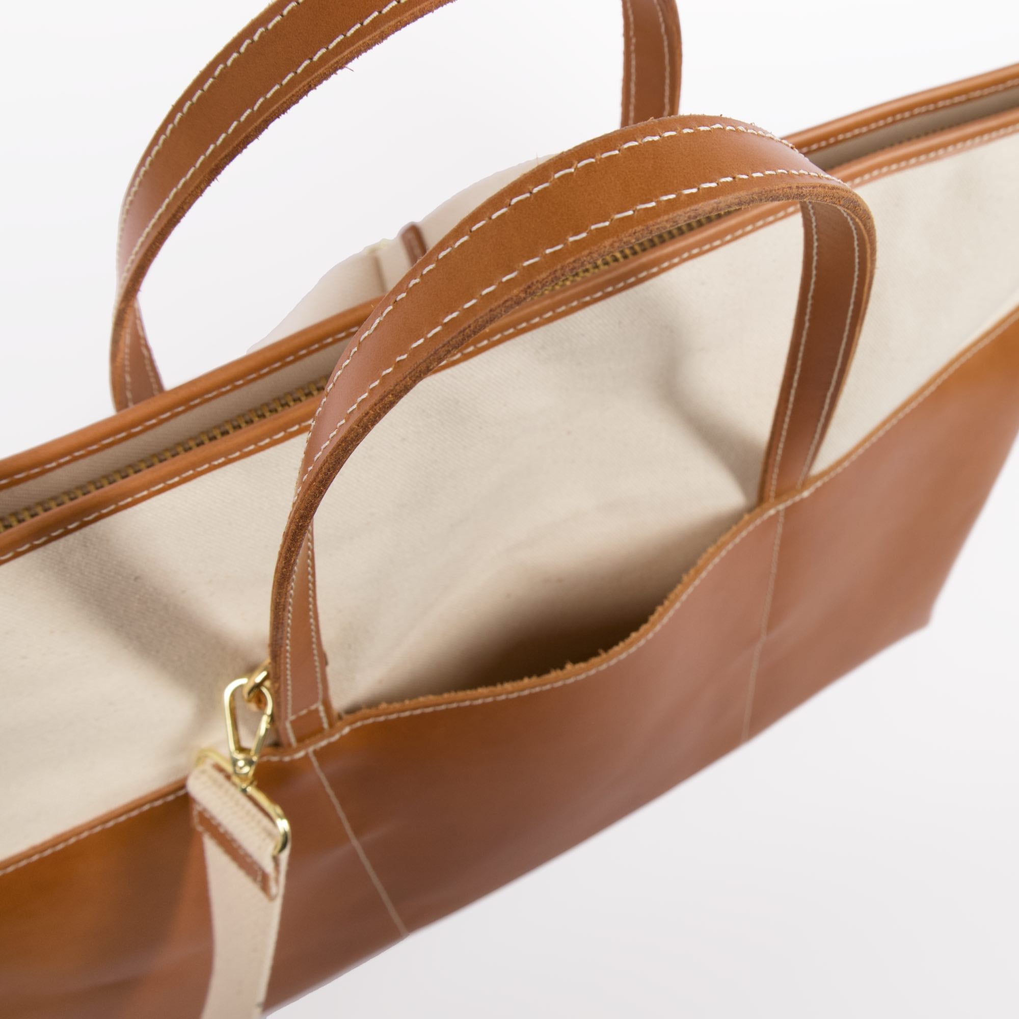 Tuscany weekender bag in natural canyon by sonoma county leather strap and pocket close-up aerial