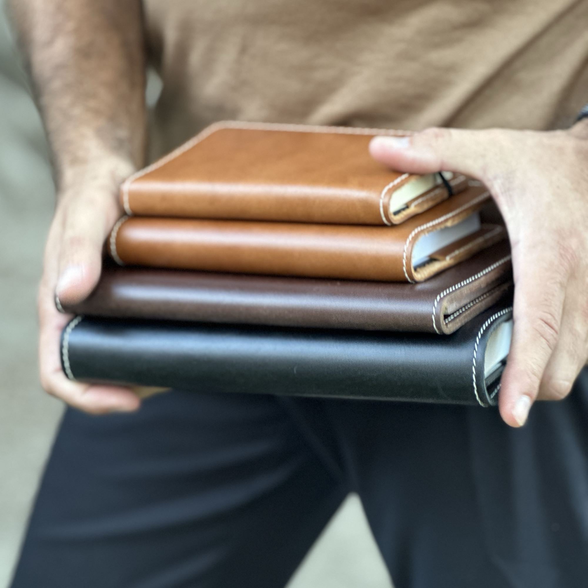 Vintner large journal and small portfolio in cyclone by sonoma county leather stacked lifestyle