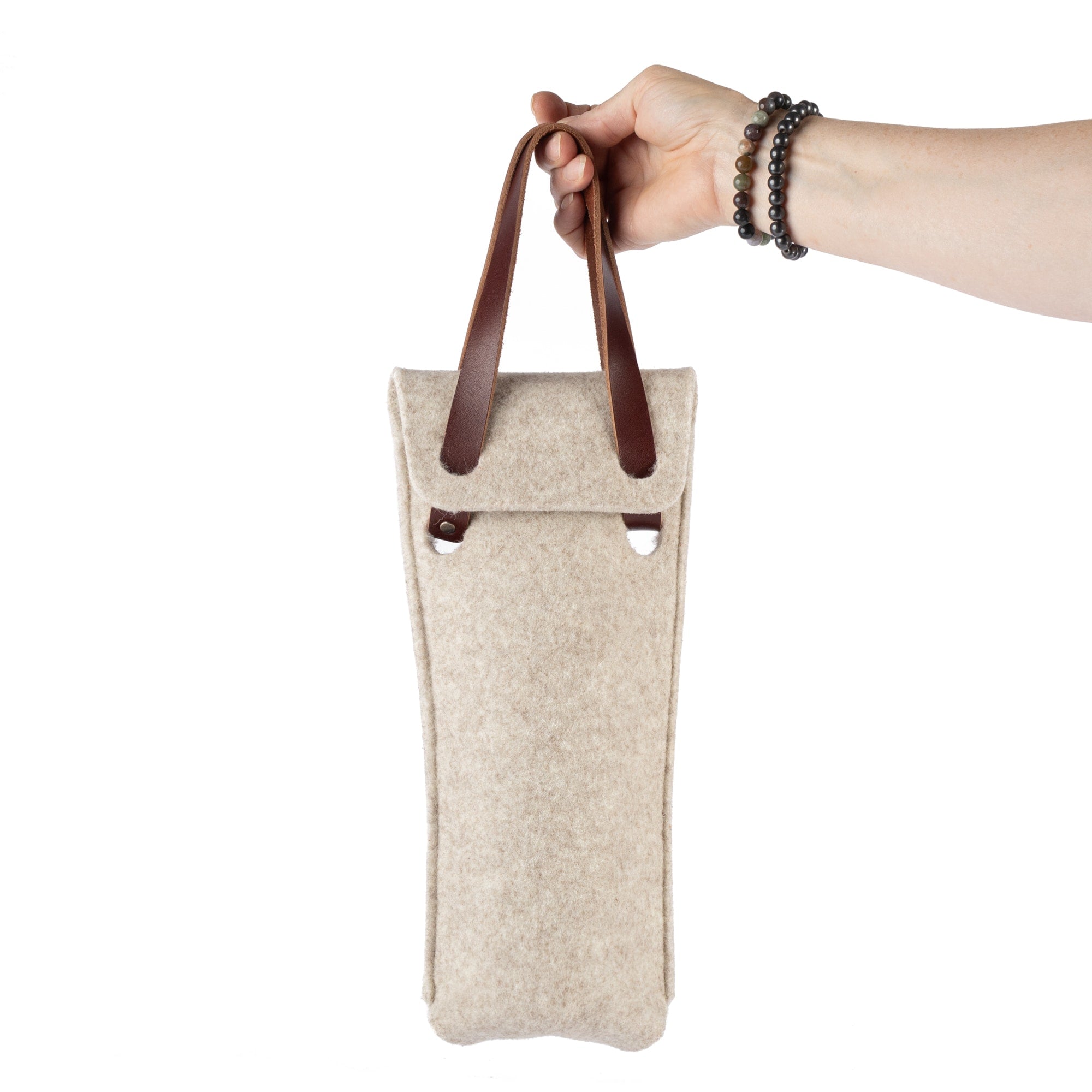 Single bottle felt wine bag by sonoma county leather in oatmeal front hand holding